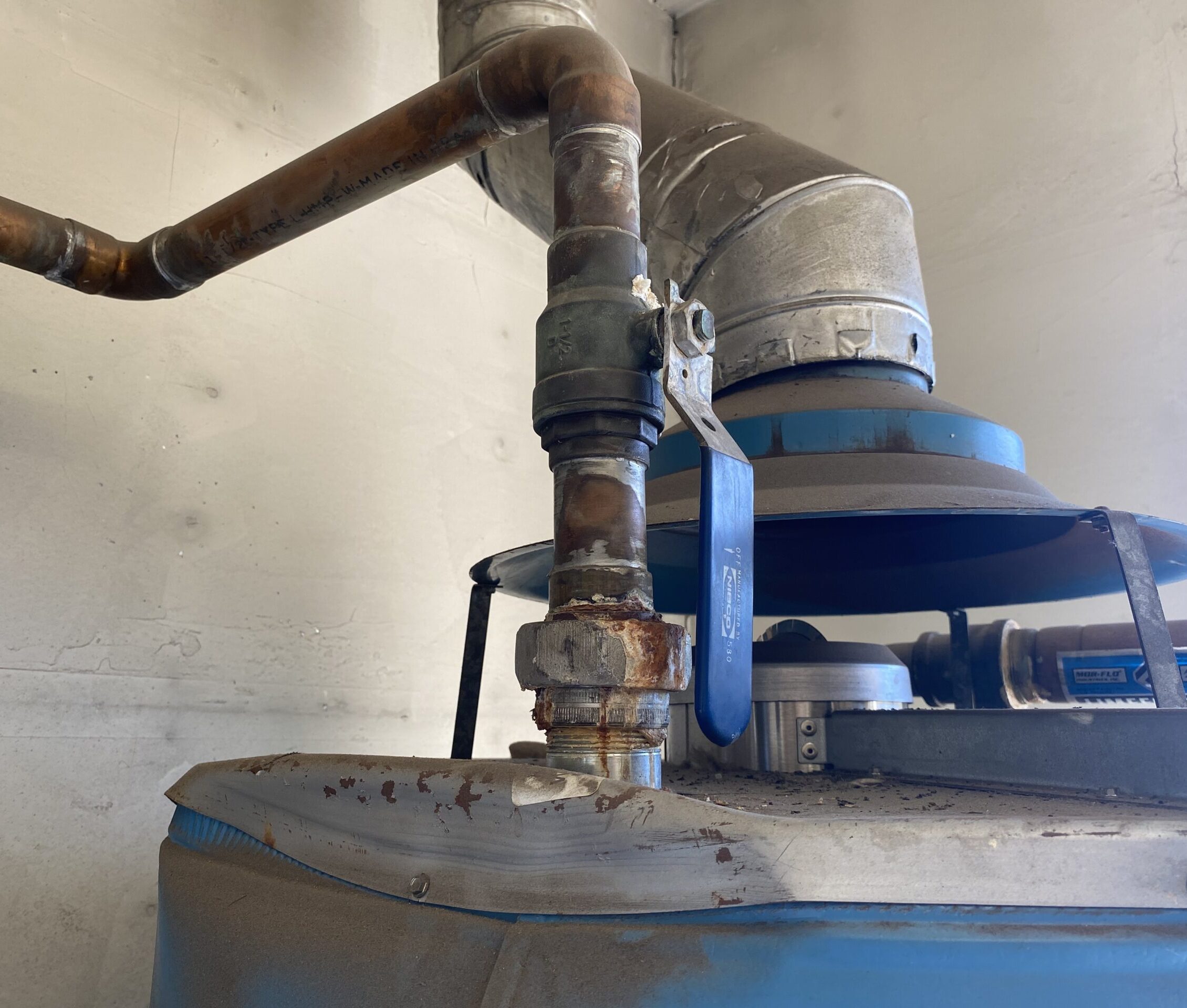 A water heater in Ramona is beginning to corrode due to age and hard water conditions.