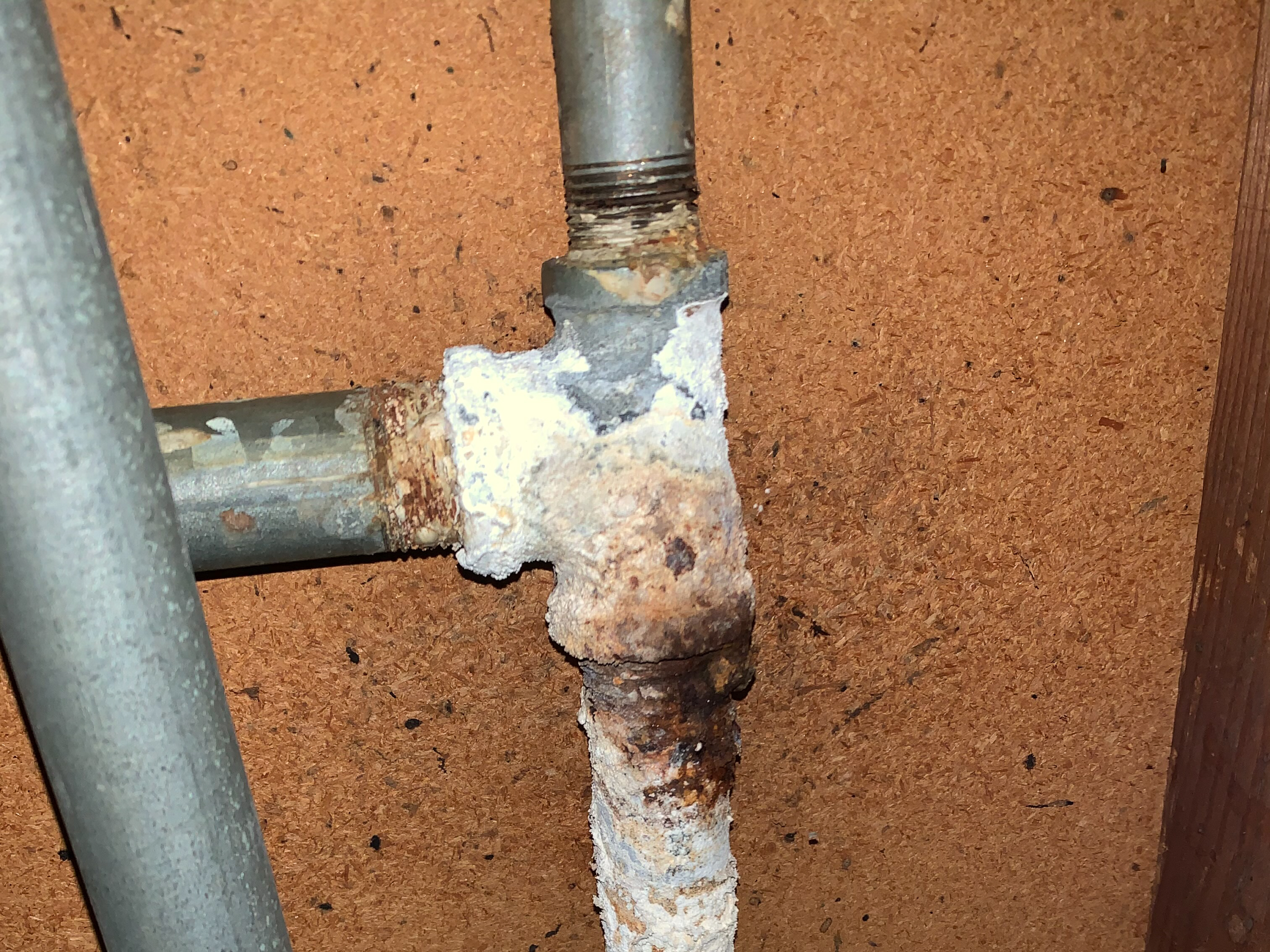 A home is being repiped with PEX pipe due to aged and corroded galvanized piping.