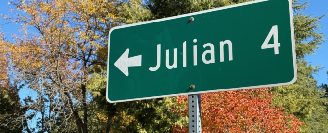 A highway sign points to Julian, CA, just 4 miles away.