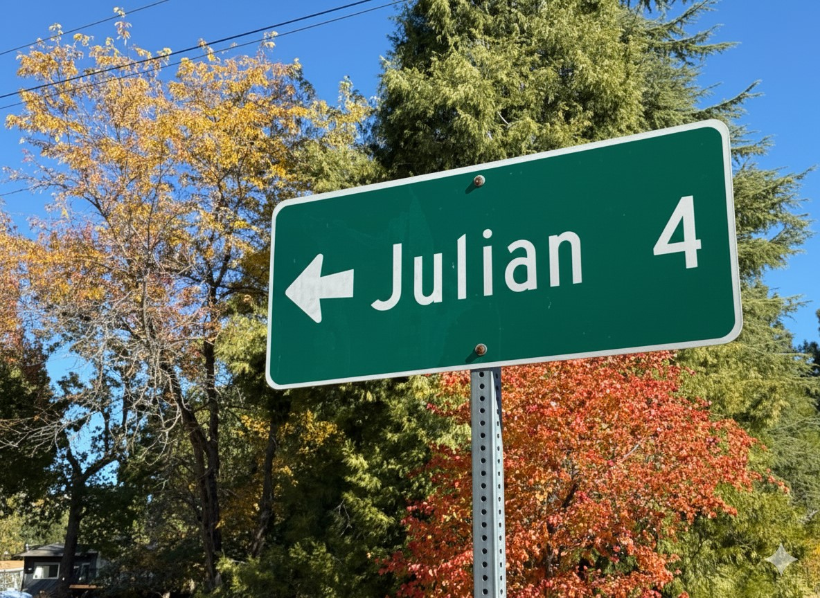 A highway sign points to Julian, CA, just 4 miles away.