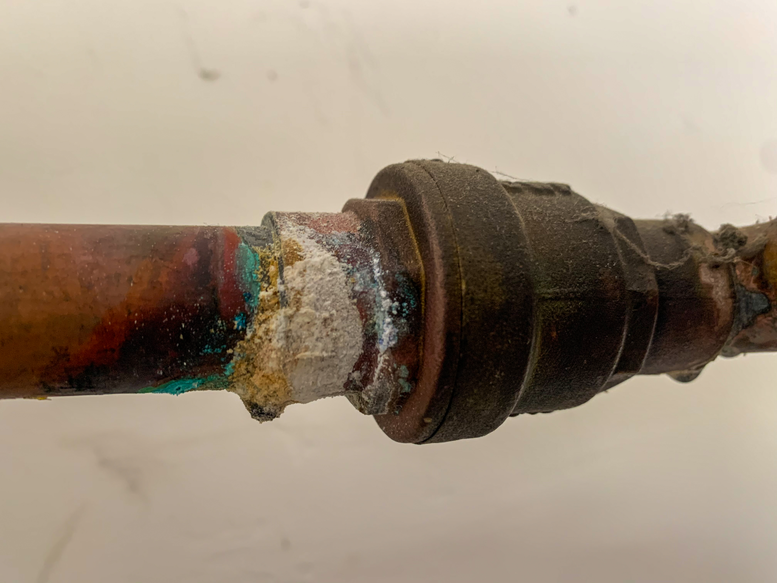 A routine plumbing inspection reveals corrosion of some copper piping in the garage.