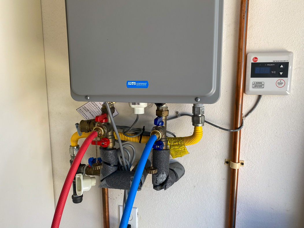 little-guy-plumbing-water-heater-flush-poway A tankless water heater in Poway is being flushed with descaling solution.