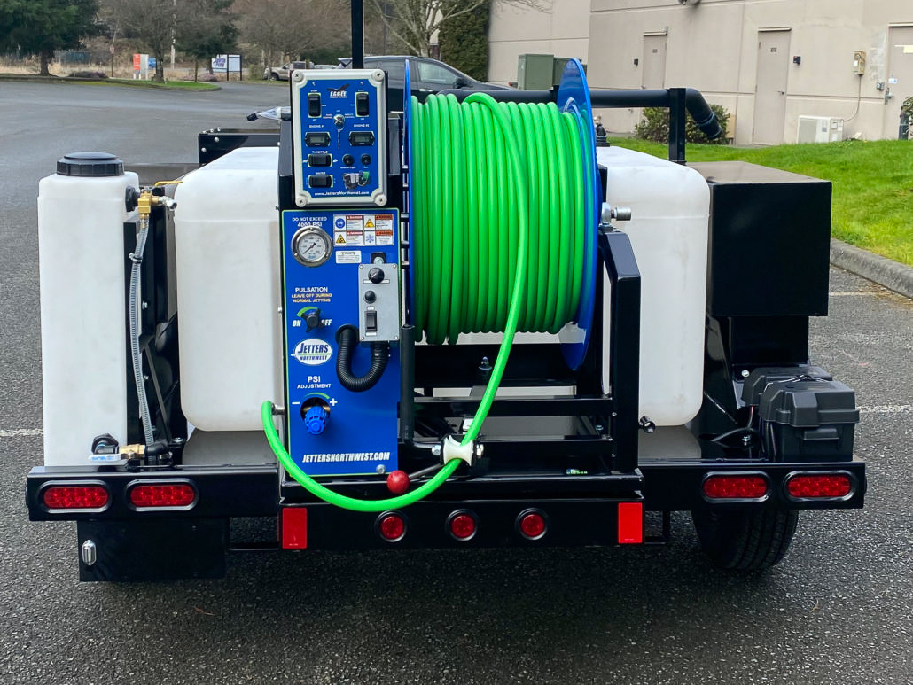 A plumber shows his hydro jetting equipment mounted to his work truck.