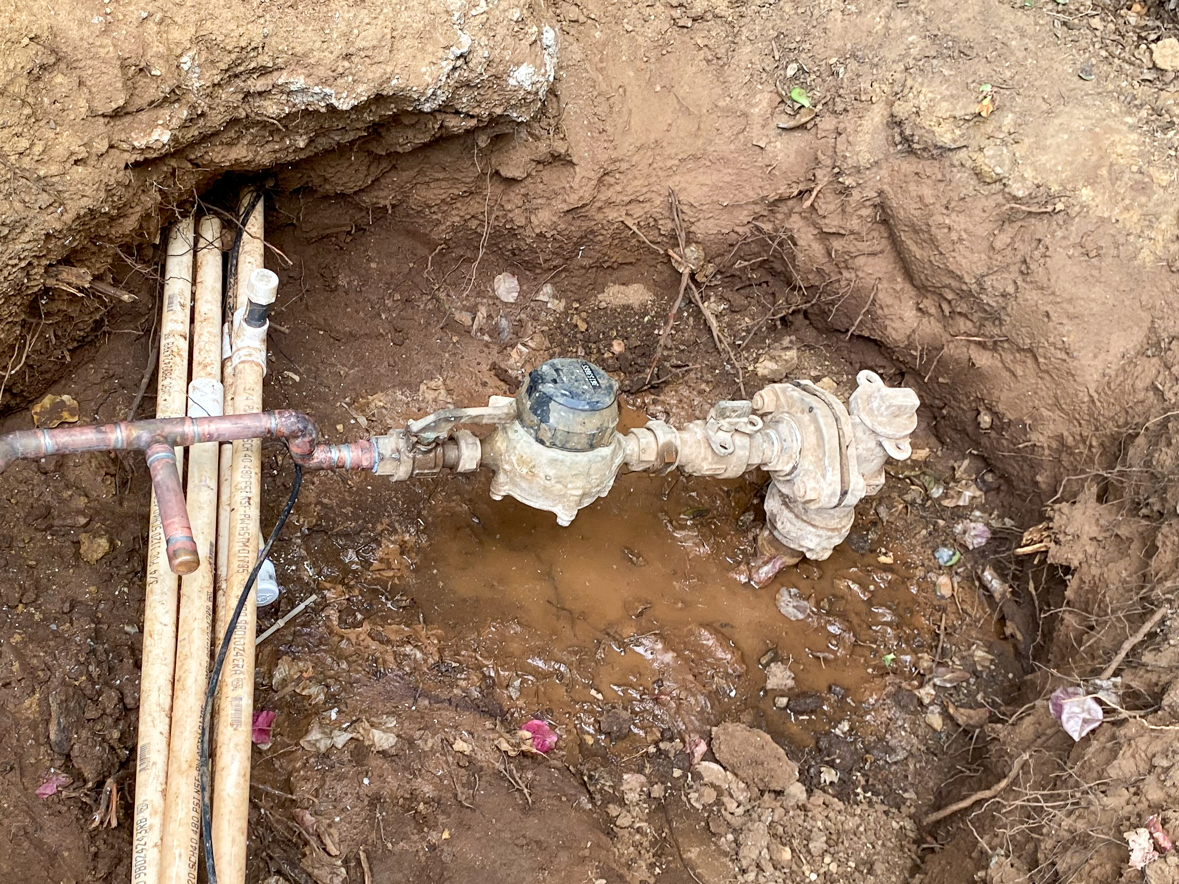 main-water-service-line-leak A main service line leak at a home in Escondido is being repaired by a professional plumber.