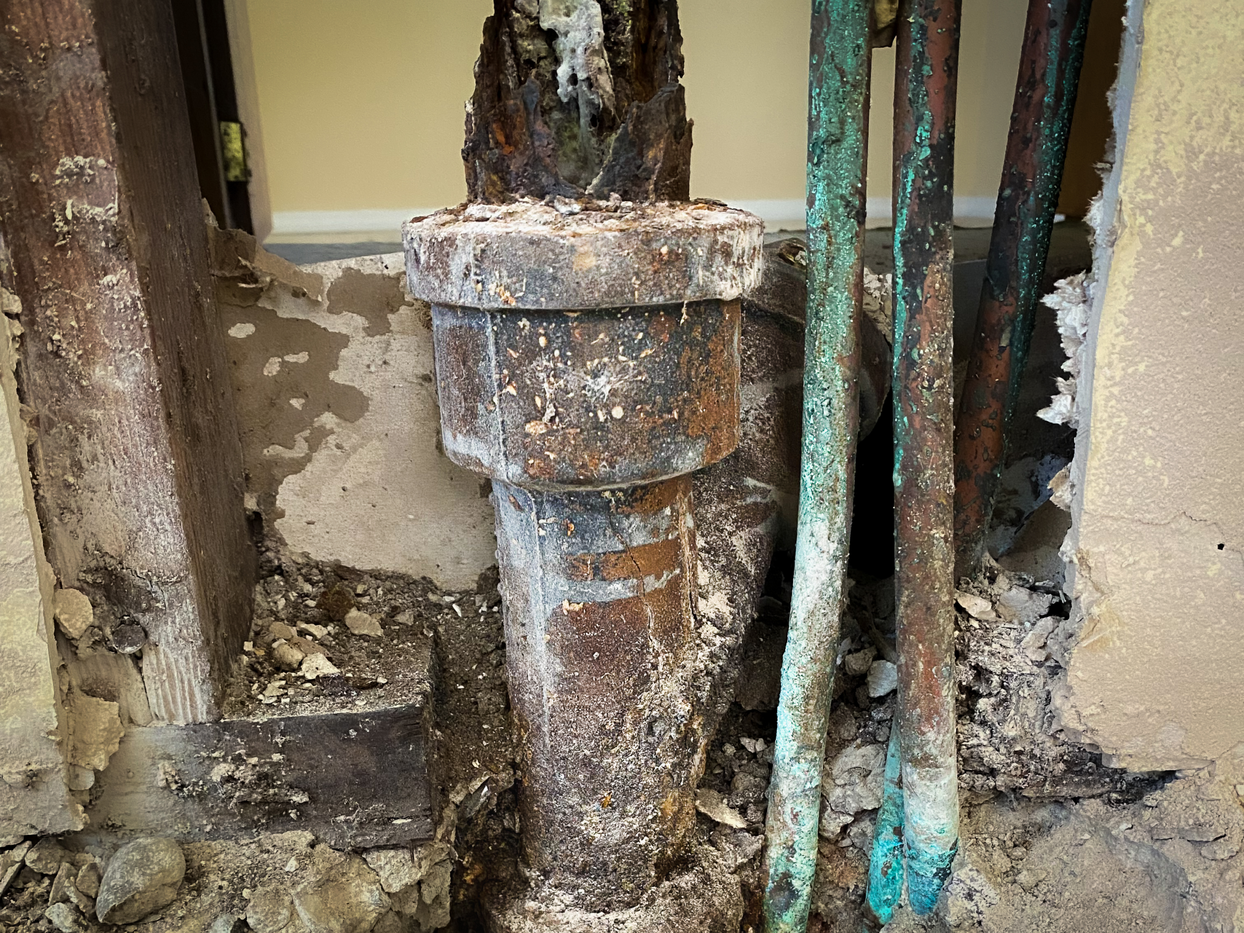 A water reroute is needed after a plumber exposes corroding copper pipes beneath the slab.