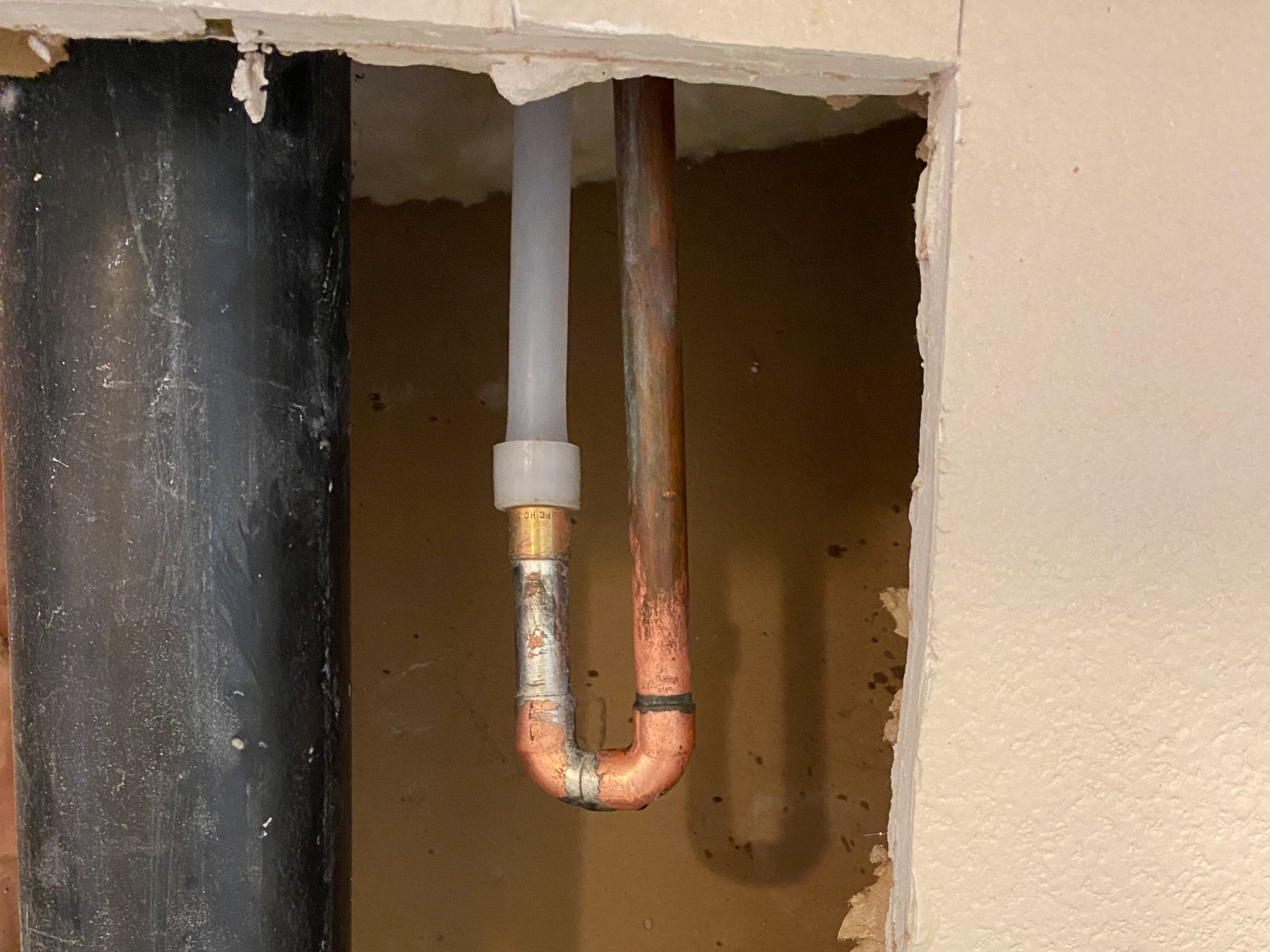 A plumber in Escondido completes a water reroute after the homeowner encountered a slab leak.