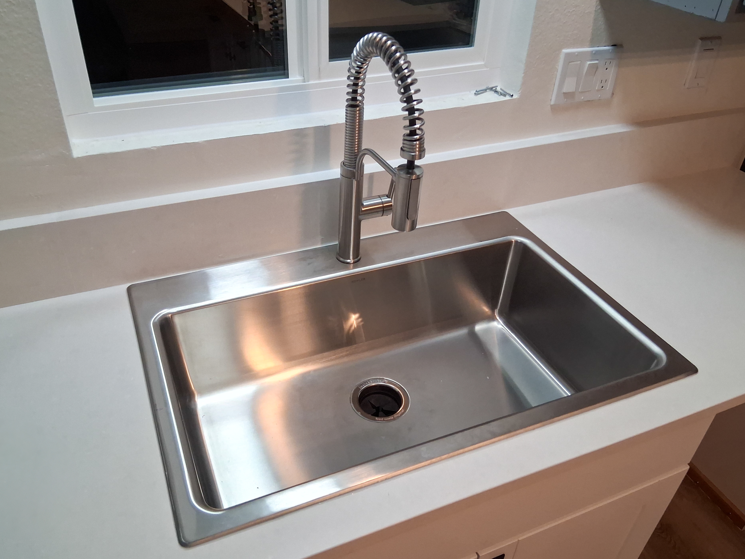 kitchen-sink-faucet-installation A stainless steel single-compartment kitchen sink with new kitchen faucet was installed during a remodel in an Escondido home.