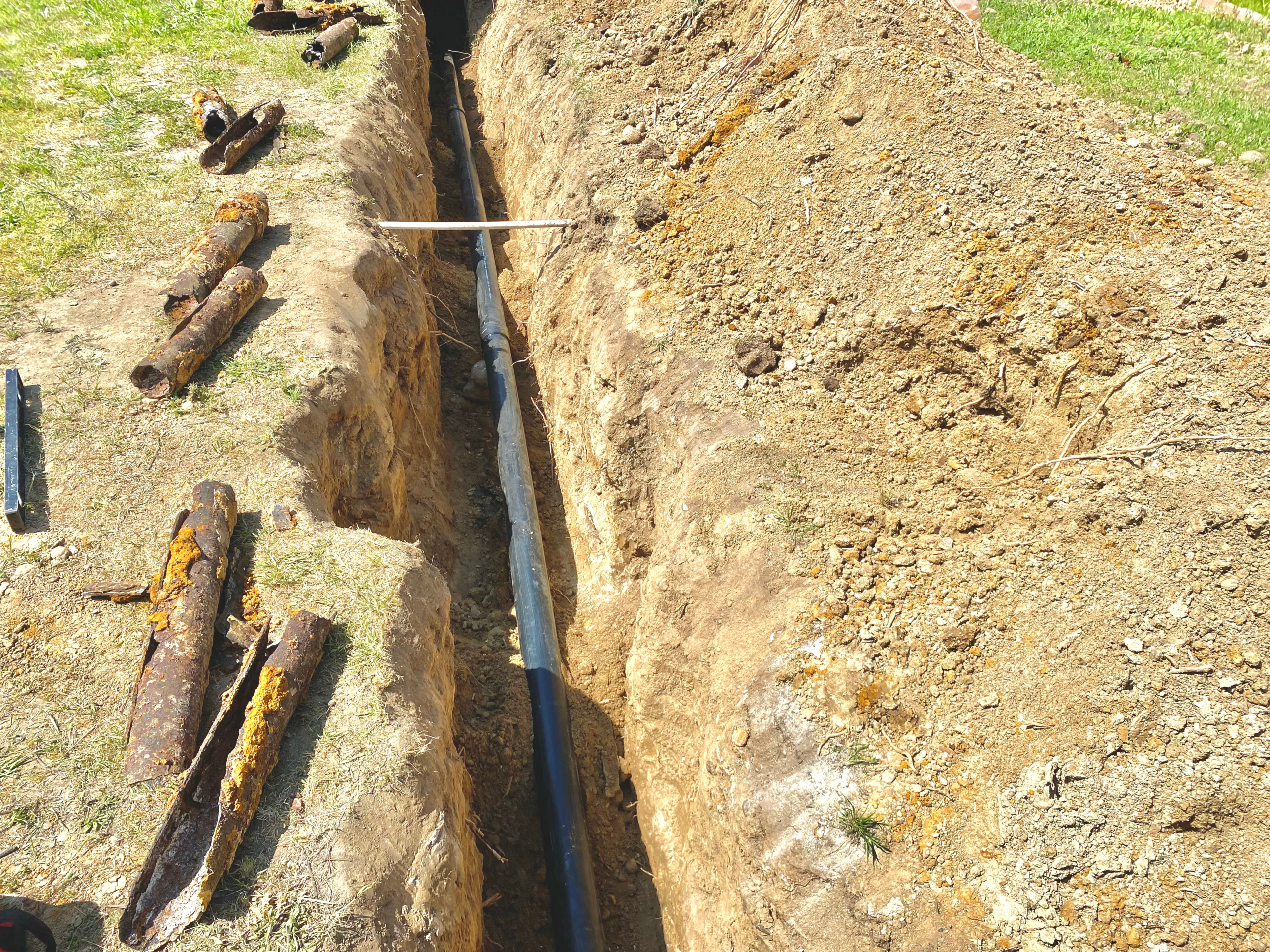 A cast iron main sewer line was replaced with new ABS plastic to resolve leaks, improve flow and avoid drain blockages.