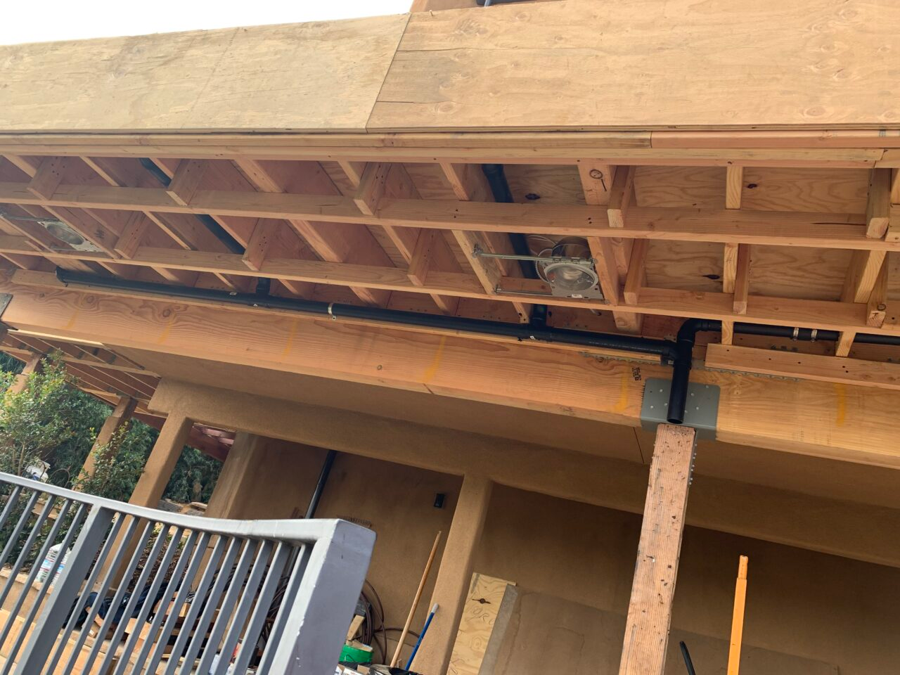 A new construction project in Escondido features a new deck with an intricate drainage system.