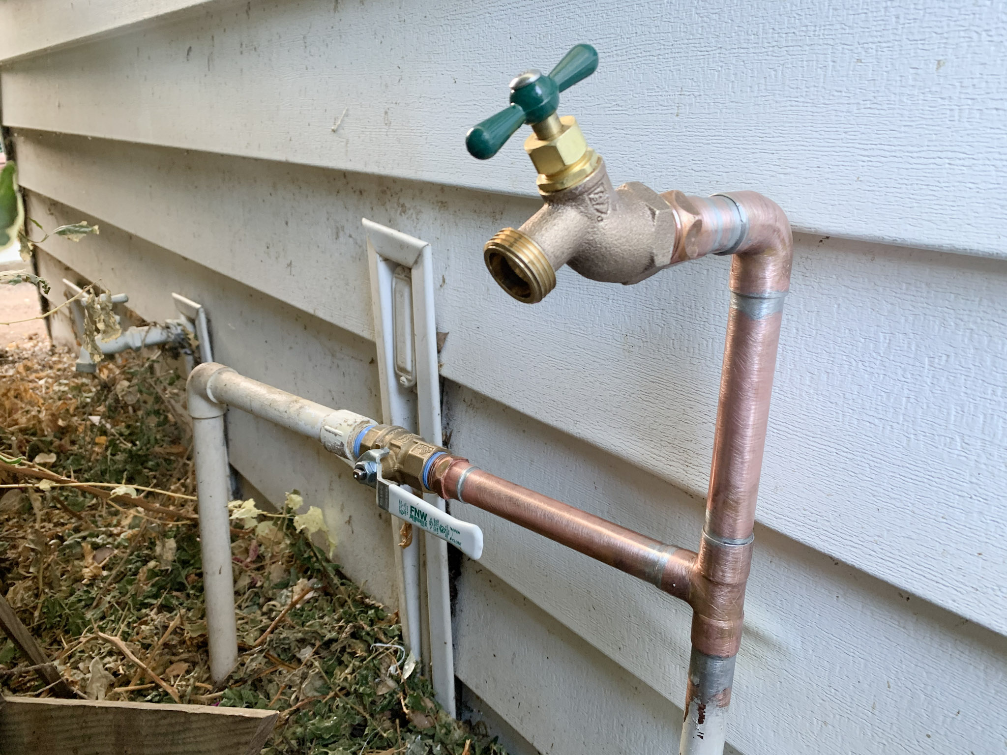 An outdoor hose bib, also known as a spigot, is replaced to resolve a leak at an Escondido home.