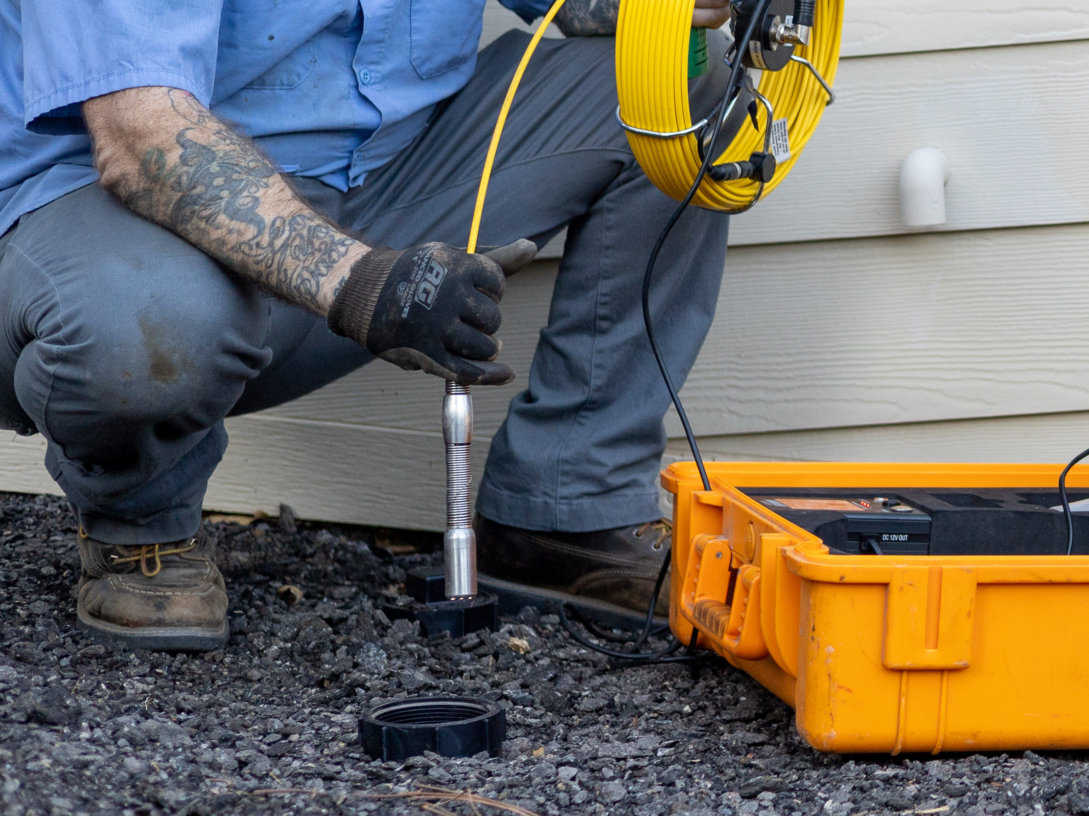 A sewer camera inspection is underway at a home in Escondido with a history of main line blockages.