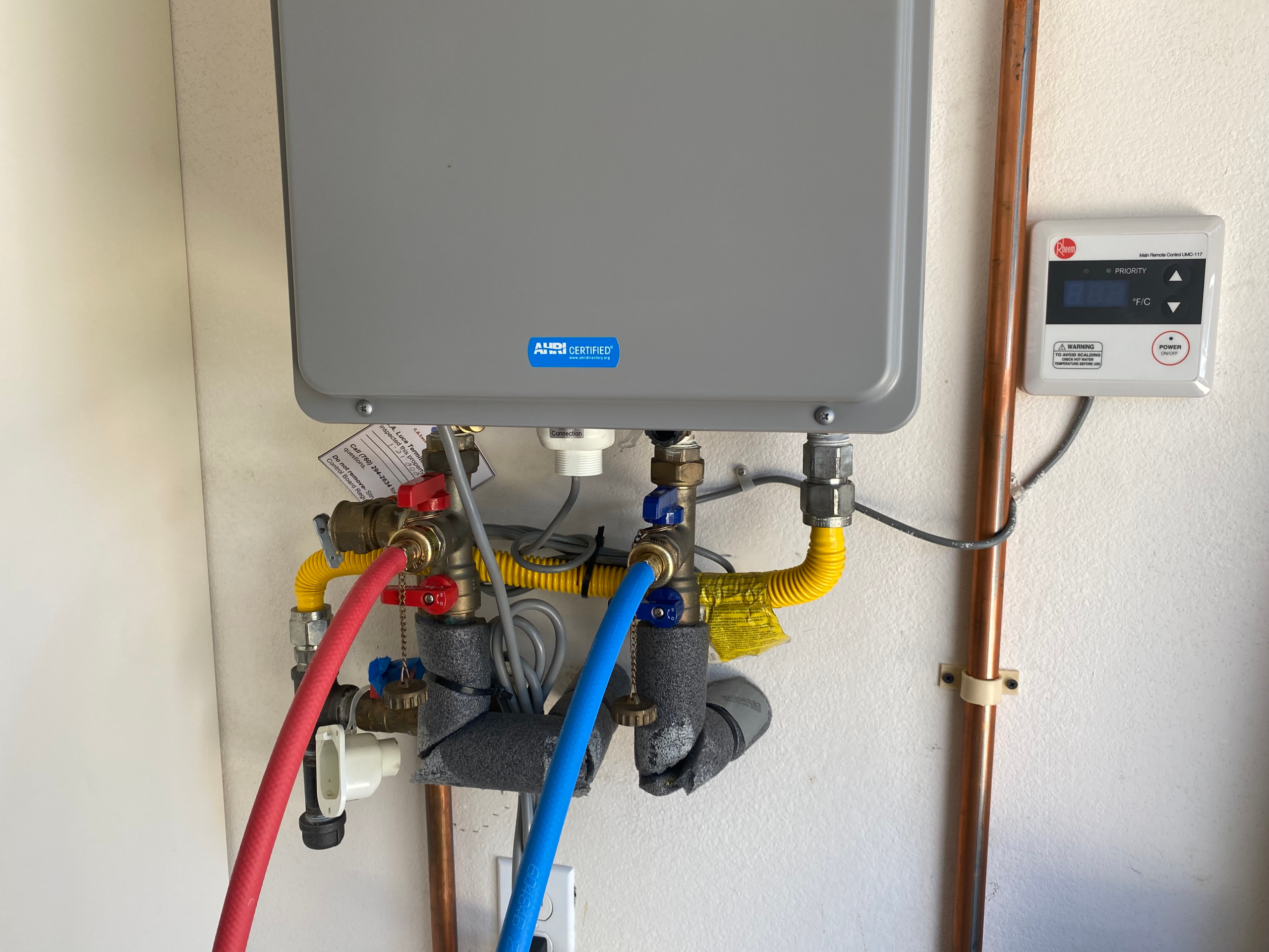 tankless-water-heater-flush As a part of routine water heater maintenance, a tankless unit is flushed with a descaling solution to prolong the life of the water heater and maximize output.