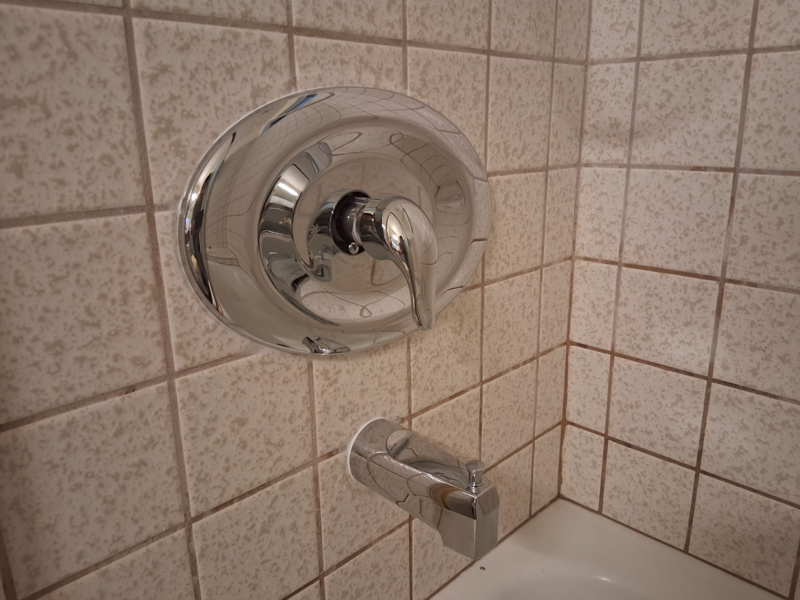 tub-shower-valve-replacement A single-handle bathroom faucet is installed as part of an upgrade.