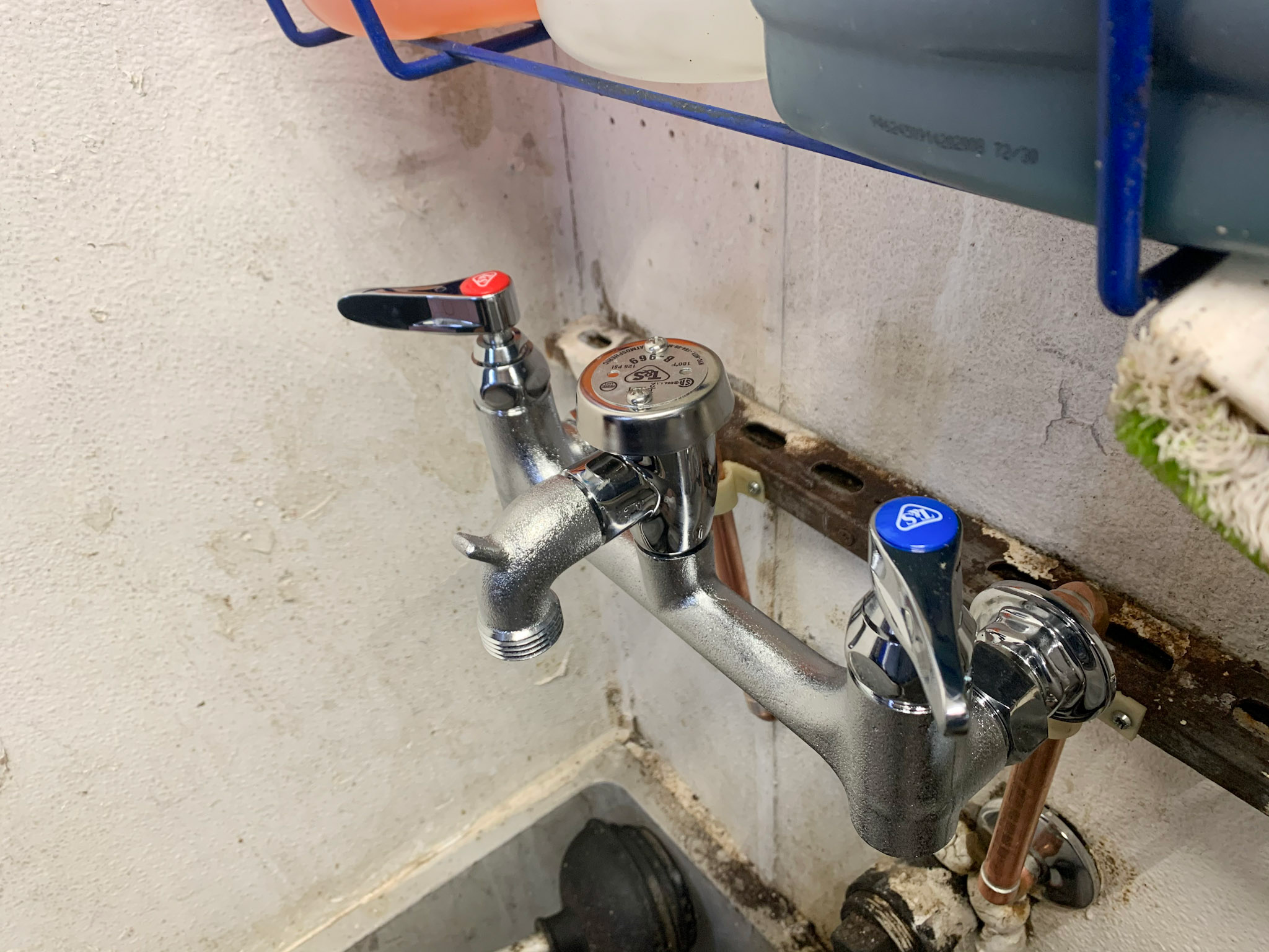 utility-faucet-replacement A wall-mount utility faucet was replaced to resolve issues with corrosion and leaks.