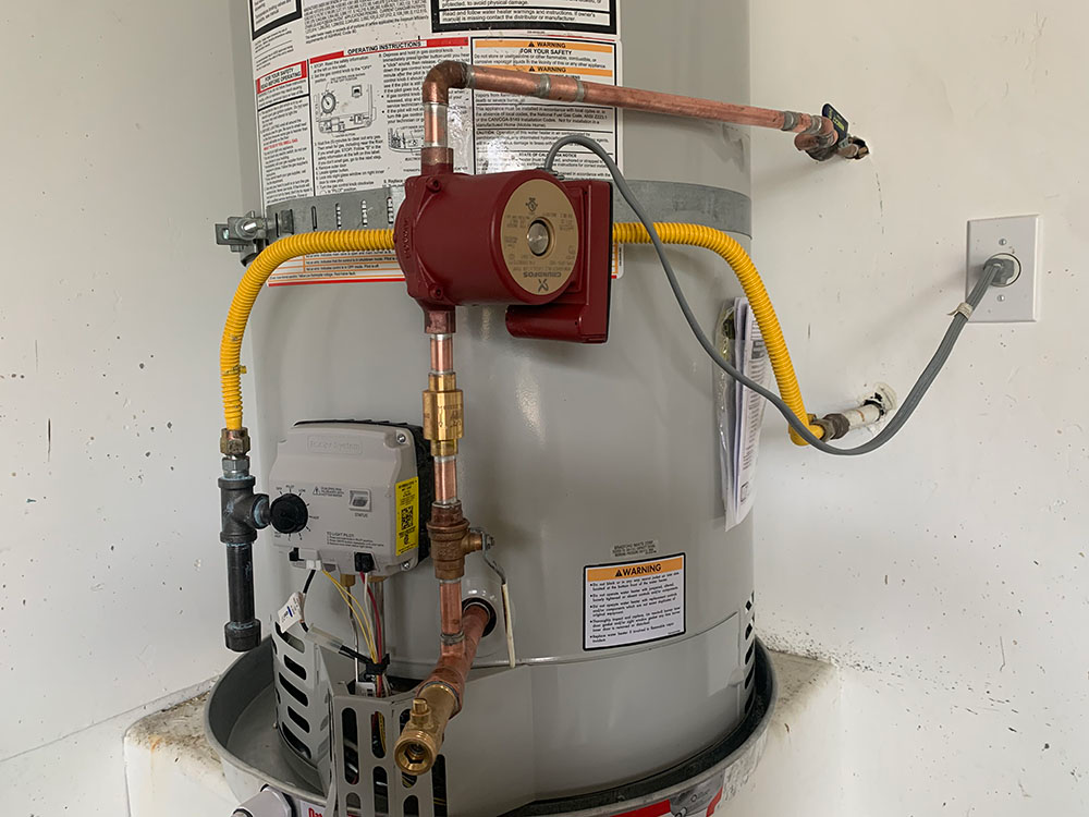 A water heater replacement in Escondido, CA includes a gas sediment trap, new gas flex line and installation of an optional recirculating pump.