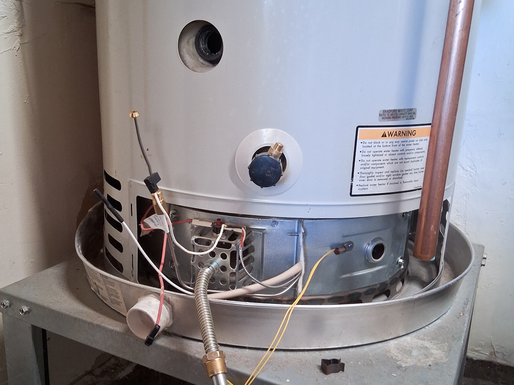 water-heater-repair-gas-control-removal With the tank completely drained, this water heater's gas control valve can be safely removed for replacement.